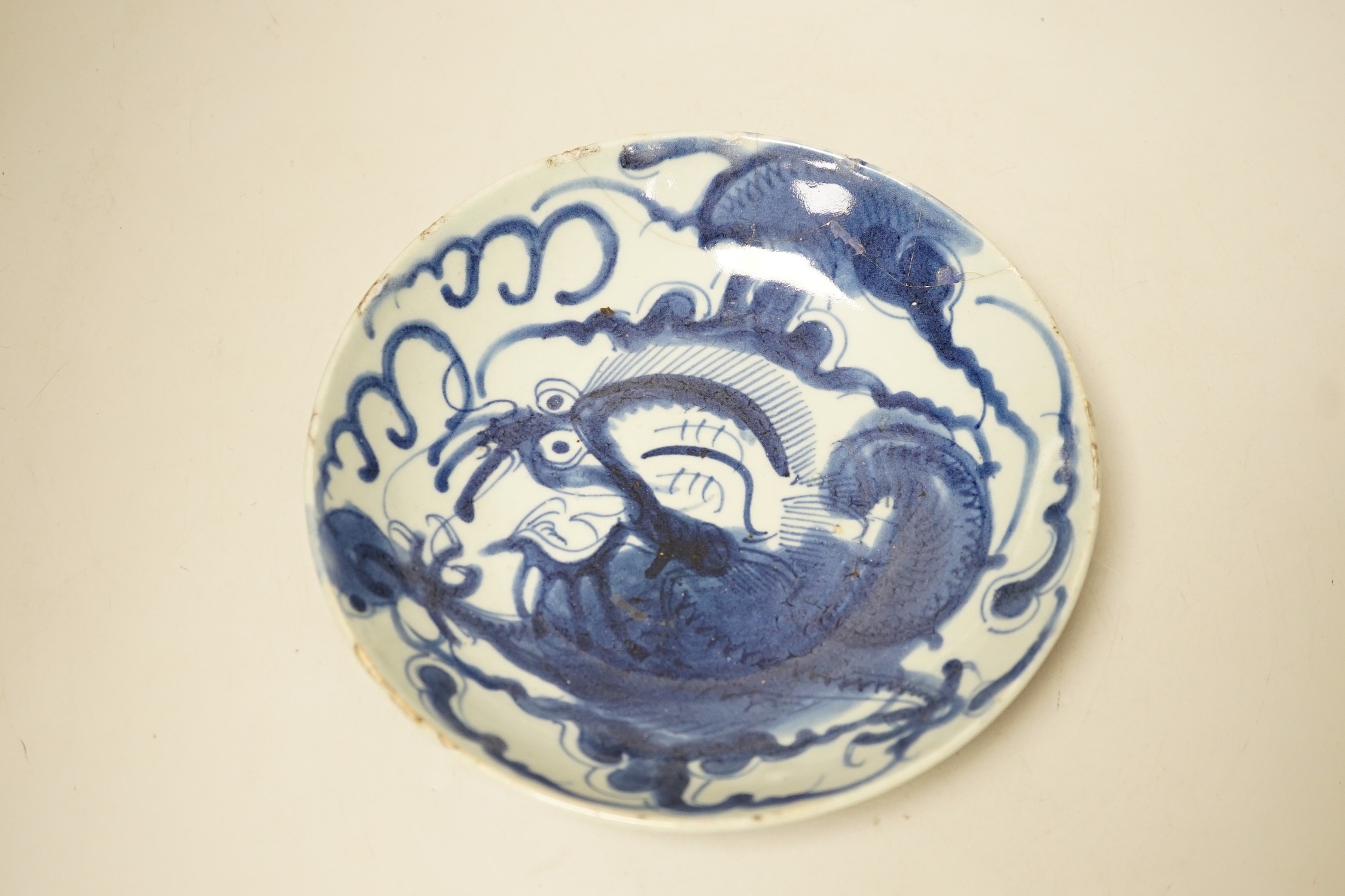 Two 19th century Chinese blue and white dishes and two 18th century tea bowls, largest 23cm diameter